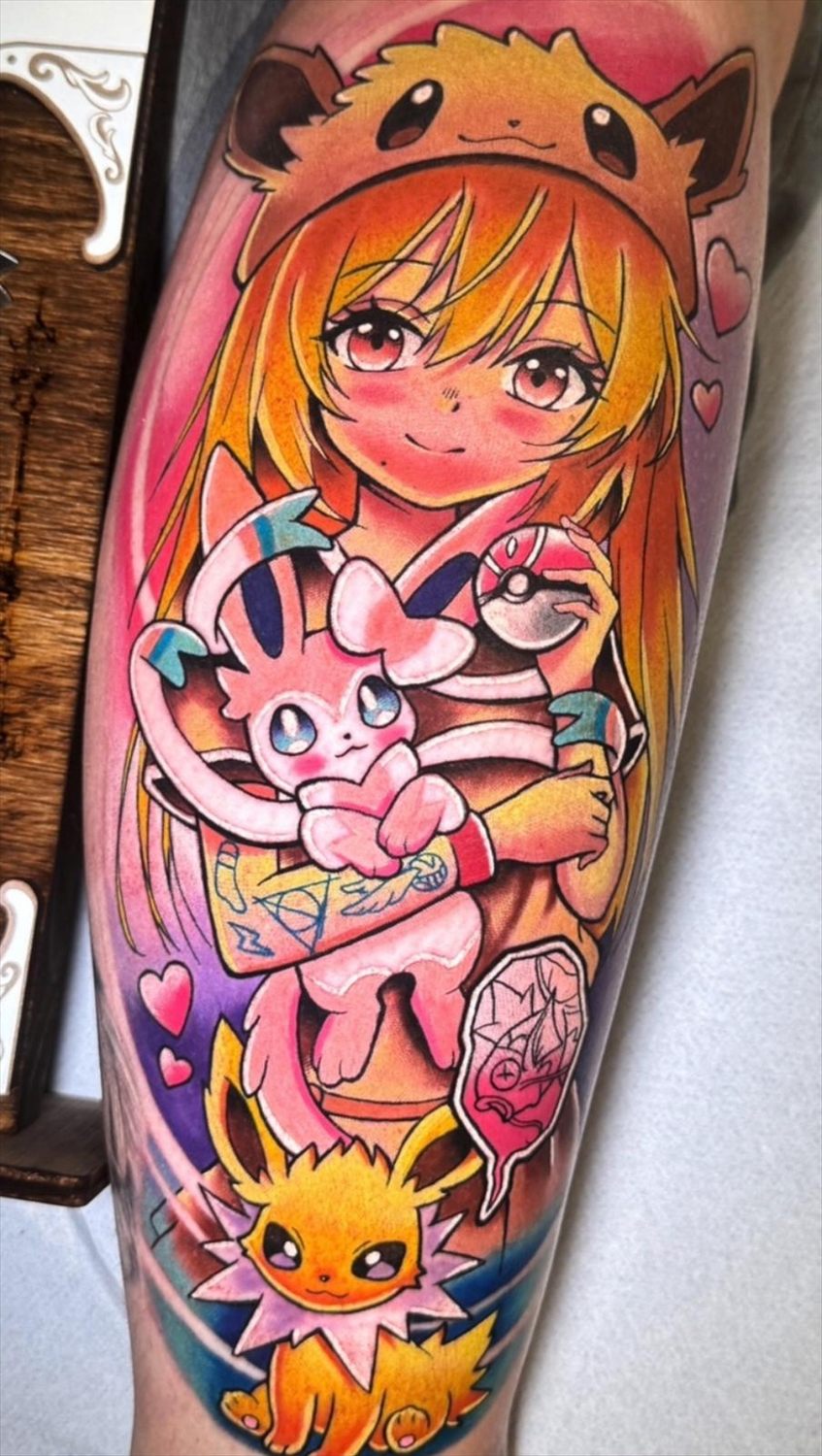 Tatuaje anime en color por Adrián en Twin Bros Tattoo